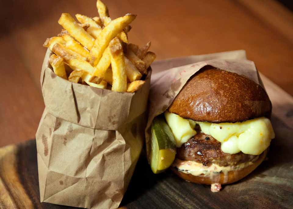Burger and fries in paper bags, courtesy of Alley Burger