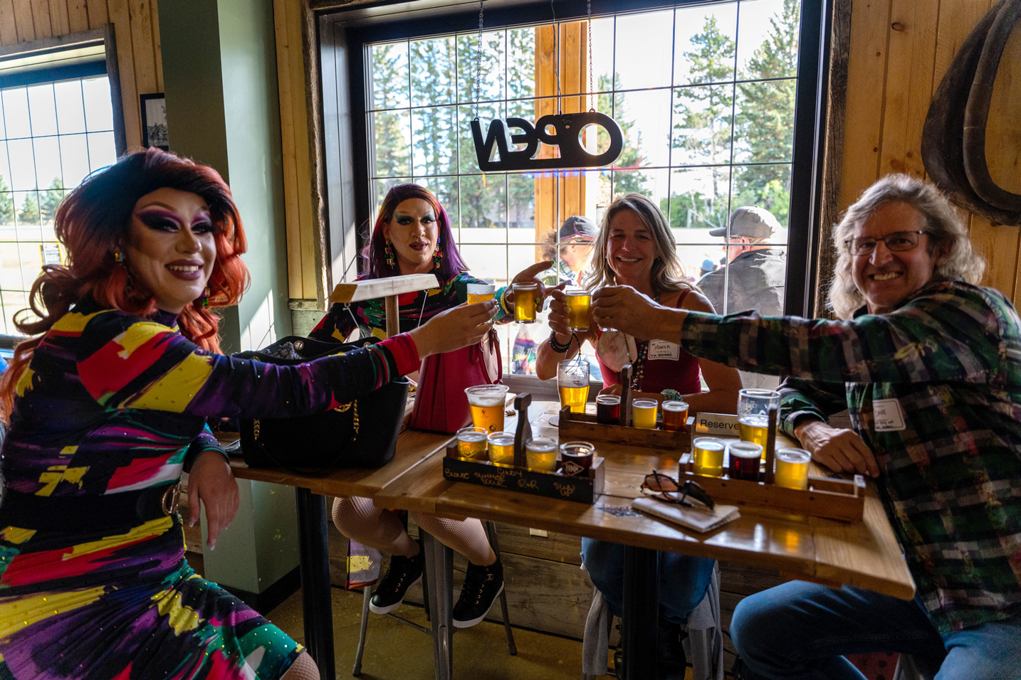 Cheers with drag queens and guests at Brewz N Booze