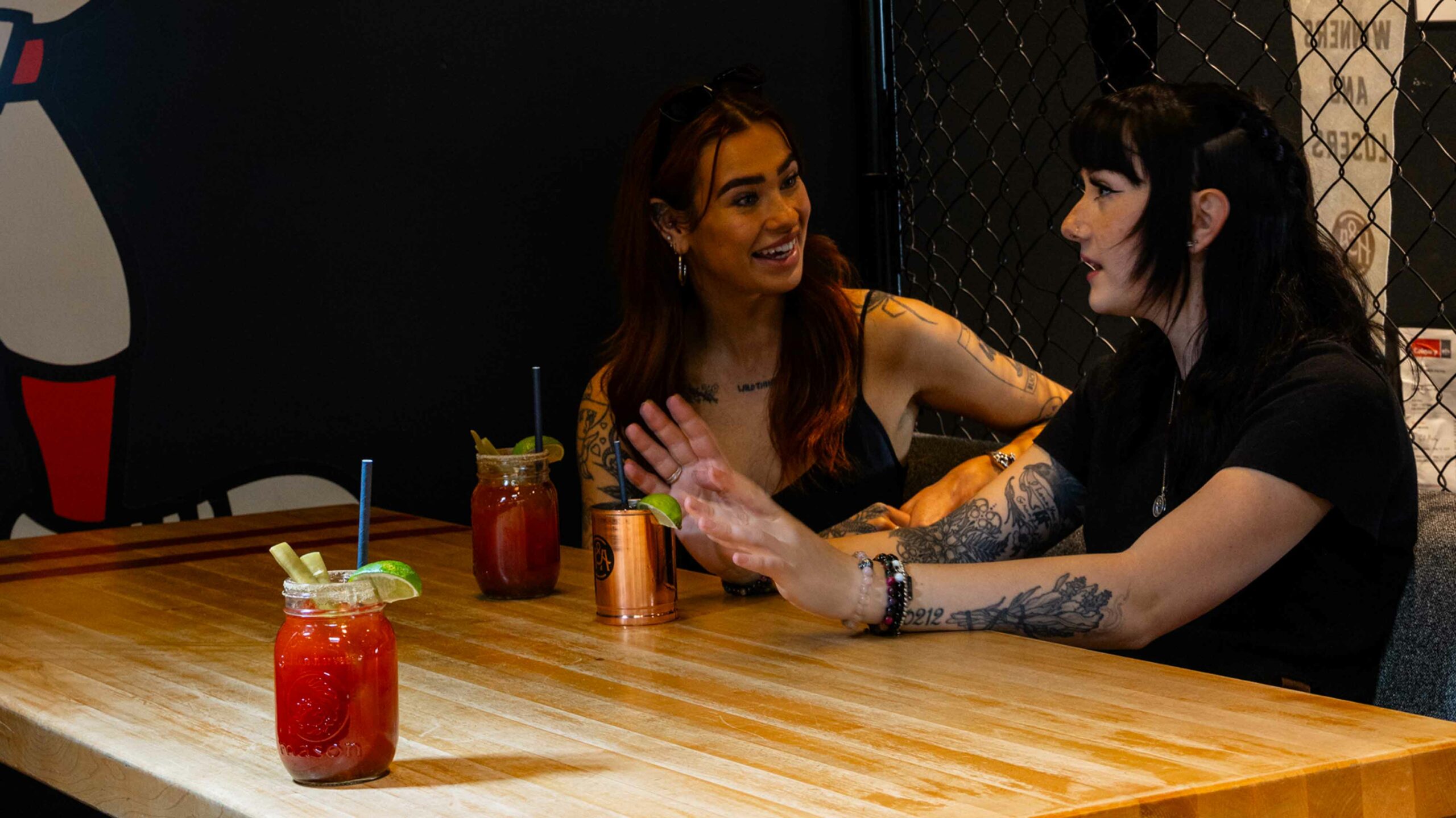 A couple enjoys drinks during a happy hour at Home and Away in Calgary